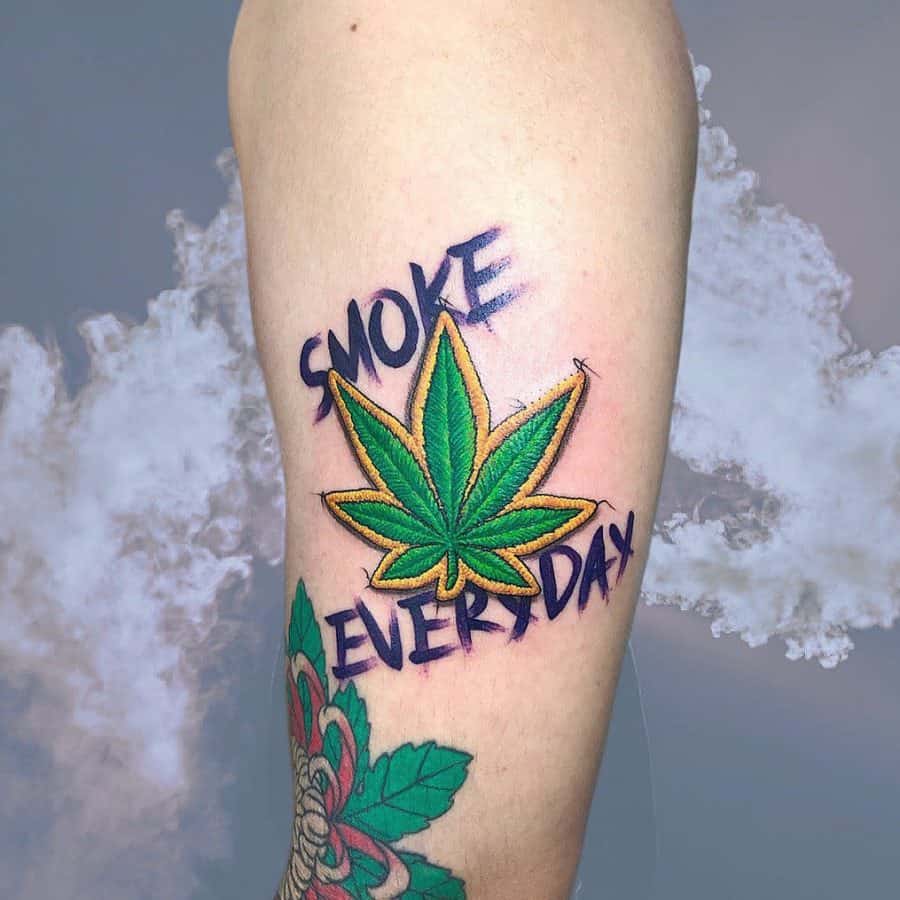 weed leaf with smoke tattoo