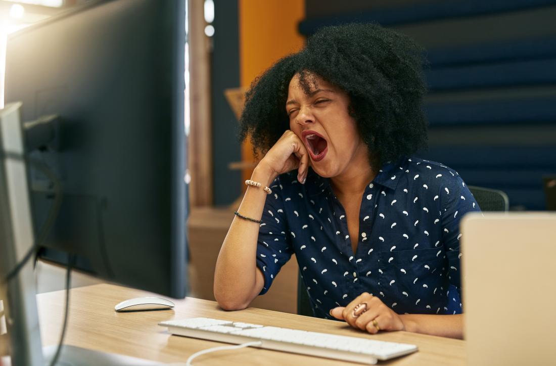 1572384716553_tired-woman-in-office-yawning-at-desk-after-eating.jpg